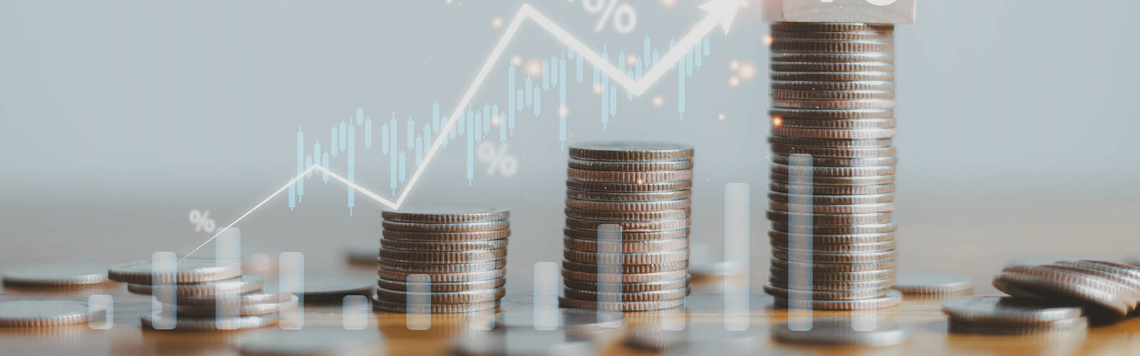 simulação de gráfico em tons de azul com moedas a registar rendimento